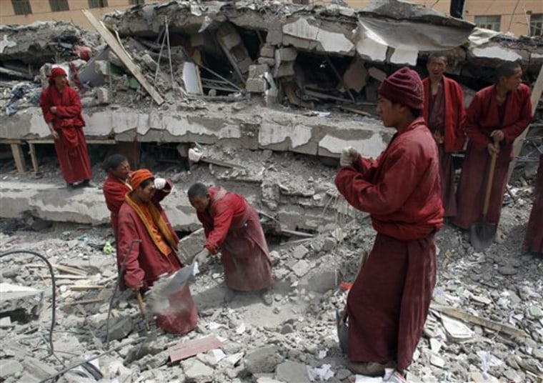 Rescuers, including Tibetan monks, probed the rubble for sounds or movement Friday in a rush to find anyone buried alive in western China. 